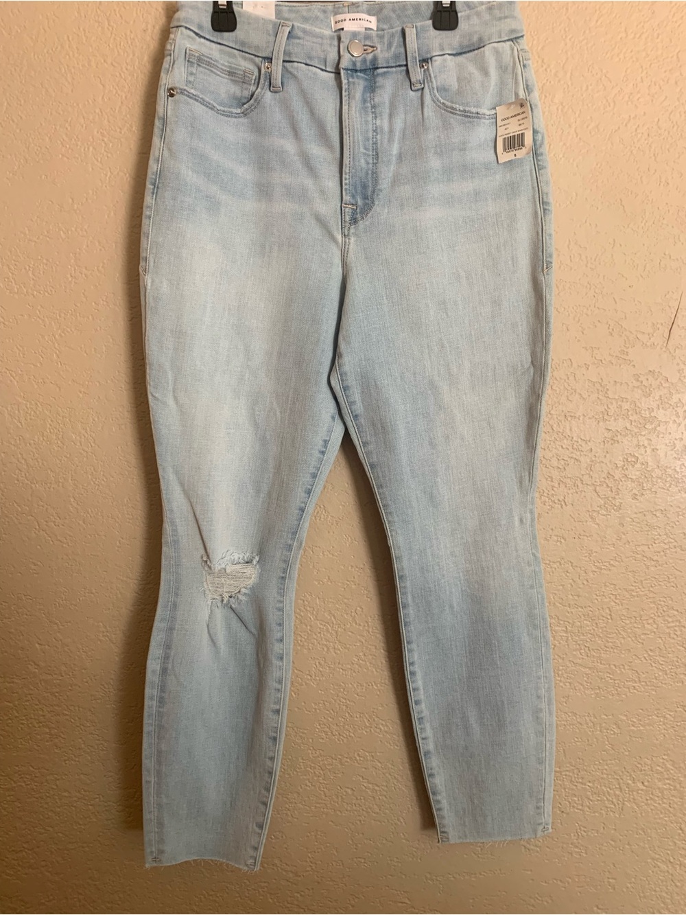 Good American Light Wash High-Rise Jeans with Knee Distress